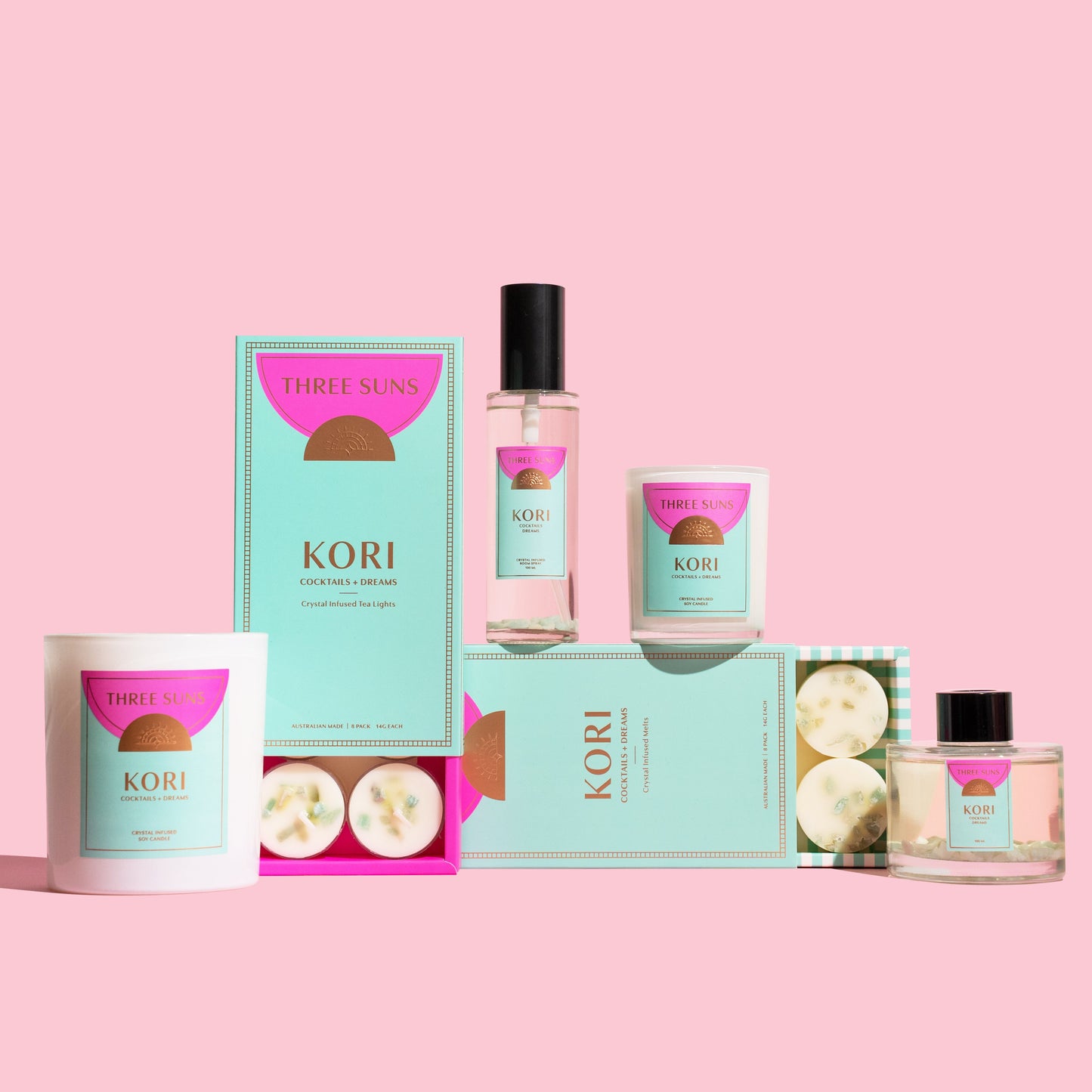 Three Suns Kori Collection featuring crystal infused soy candles, room sprays, reed diffusers, wax melts, and tealights, all infused with Amazonite crystals and fruity Cocktails + Dreams fragrance, luxury Australian home fragrance.