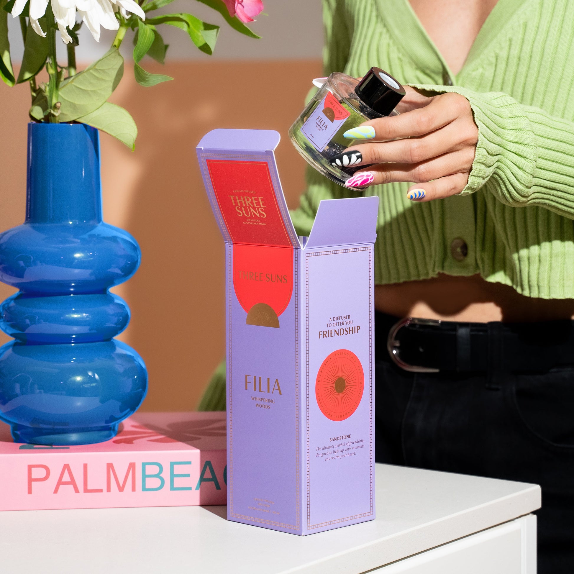 Filia Crystal Reed Diffuser in clear glass bottle with black lid and reeds, infused with sandstone crystals, luxury home diffuser, natural Australian diffuser by Three Suns.