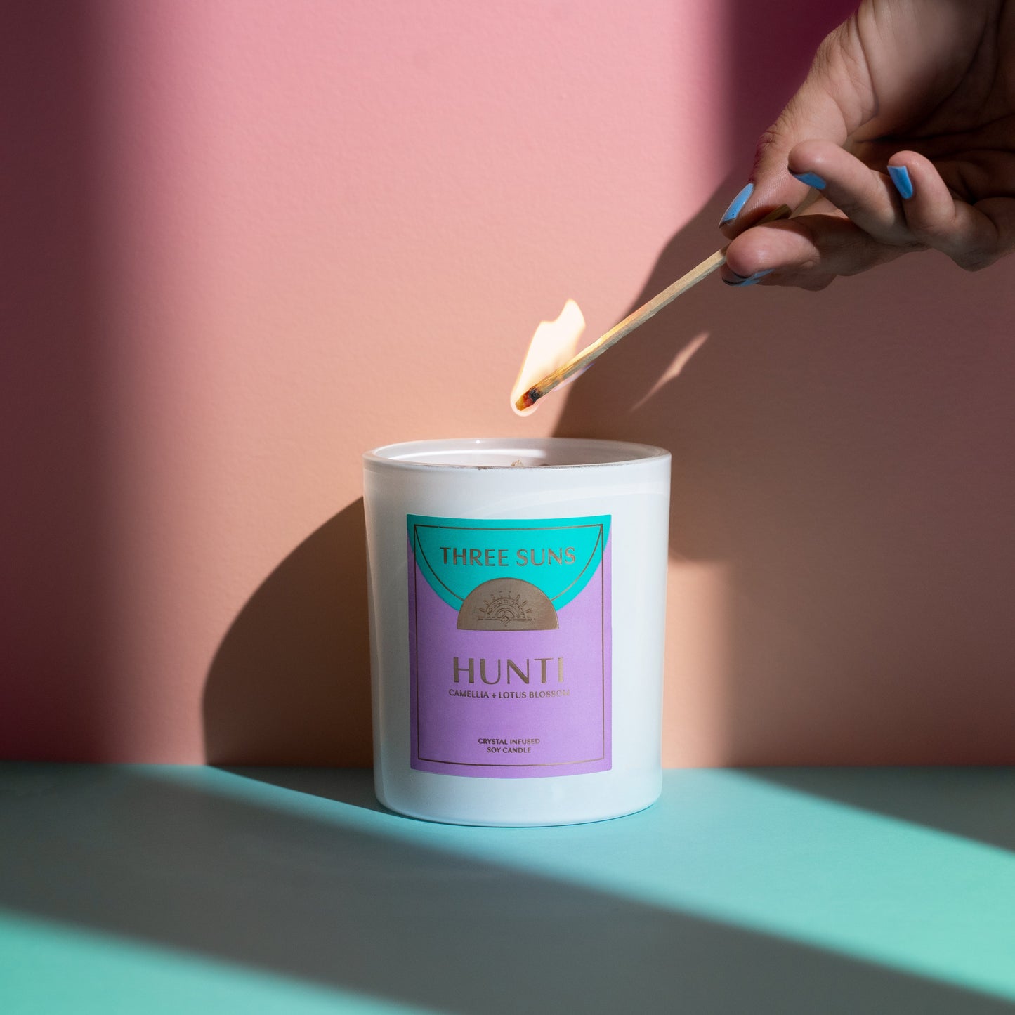 Crystal Infused Hunti Large Candle, calming Camellia and Lotus Blossom scent with Amethyst and Tiger’s Eye crystals, natural soy wax, luxury Australian candle by Three Suns.