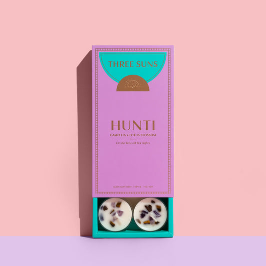 Hunti Crystal Infused Soy Tea Lights with Amethyst and Tiger’s Eye crystals, calming Camellia and Lotus Blossom scent, eco-friendly luxury candles Australia by Three Suns.
